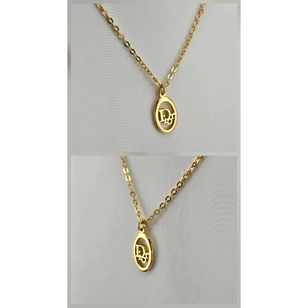Christian Dior Gold Tone Oval Logo Pendant Necklace Adjustable Chain Vintage
